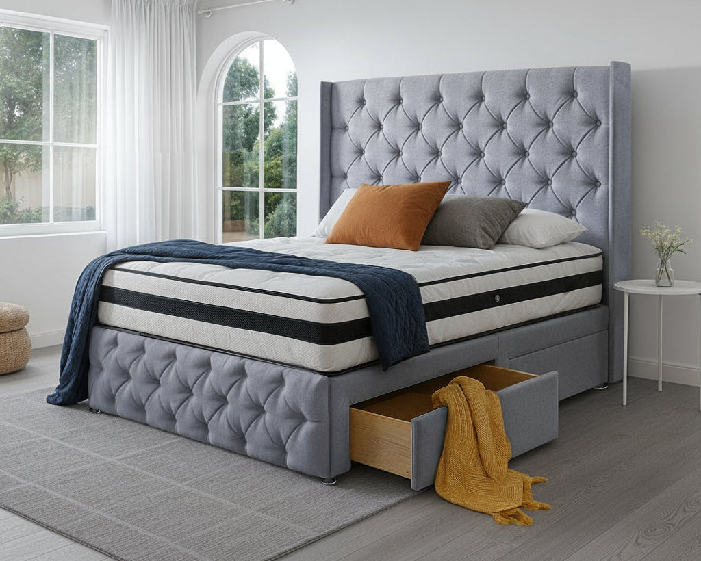 Gray upholstered bed with tufted design in a bright bedroom