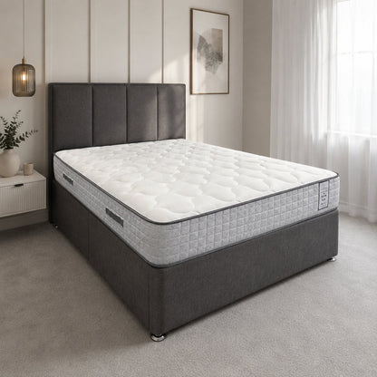 Gray bed frame with white mattress in a bedroom setting